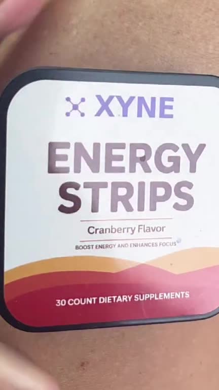 A creator in a car holds the Energy Strips tin, takes a strip, then shows a handful of cranberry sachets